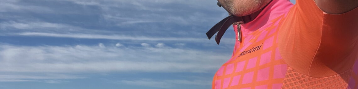 Coach Trent Renshaw cycling in a pink jersey during a pyramid training session at Toormina Velodrome.