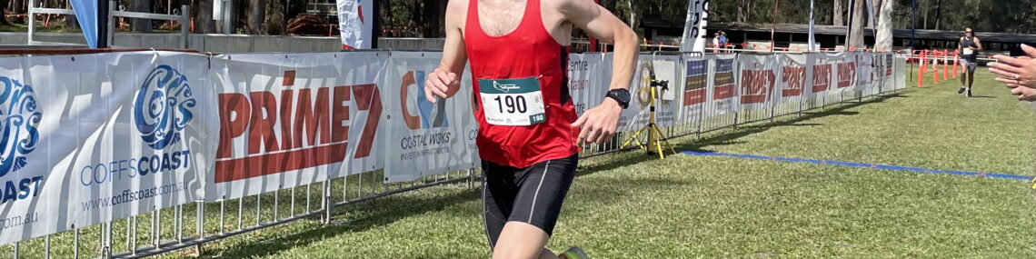 Coach and massage therapist Trent Renshaw in the finish chute at the Coffs Running Festival 2023.