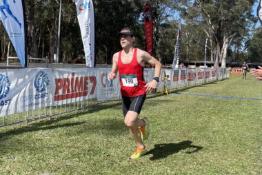 Coach and massage therapist Trent Renshaw in the finish chute at the Coffs Running Festival 2023.