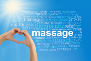 Hands forming a heart shape around a word cloud with “massage” at the centre, surrounded by related words.