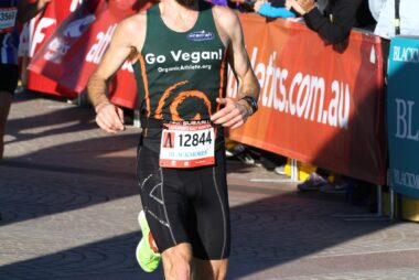 Trent Renshaw with a beard crossing the finish line at the Blackmore’s Running Festival.