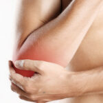 man-with-soft-tissue-injury-elbow-pain
