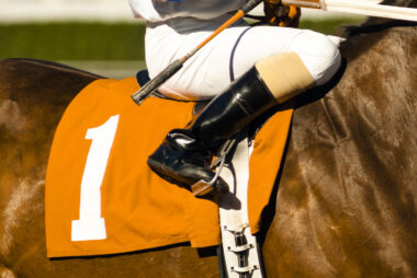 Jockey,Rides,Horse,Along,Track,Preparing,For,Race,Number,One